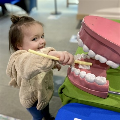 Child brushing big teeth